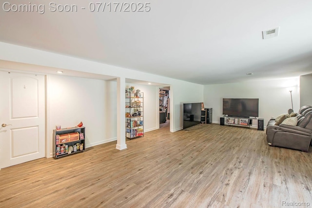 5074 Perryville Rd, Holly, MI 48442 - living area featuring light wood-style flooring and baseboards