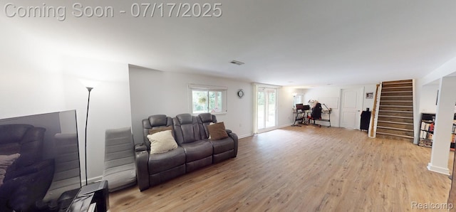 5074 Perryville Rd, Holly, MI 48442 - living room with light wood finished floors and stairs