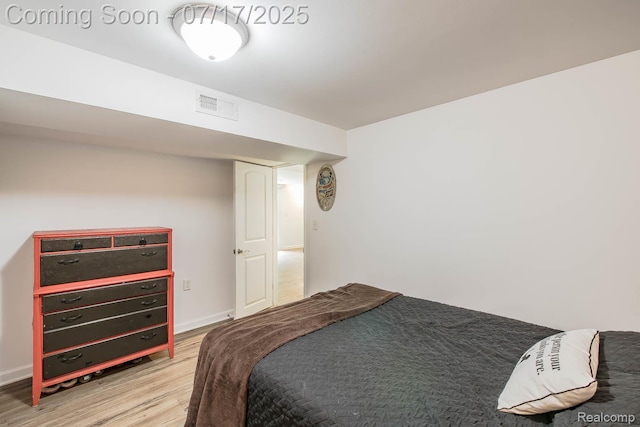 5074 Perryville Rd, Holly, MI 48442 - bedroom featuring wood finished floors and baseboards