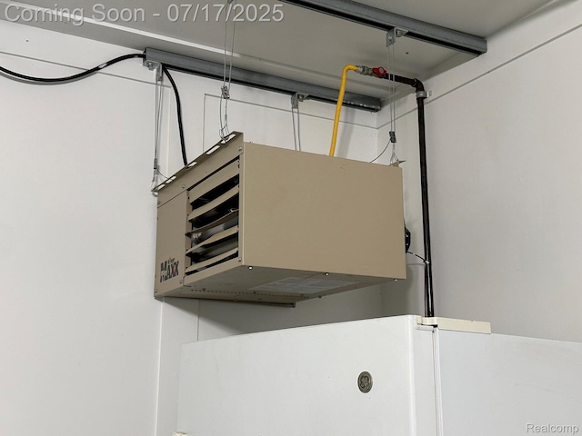 5074 Perryville Rd, Holly, MI 48442 - garage view of a heating unit