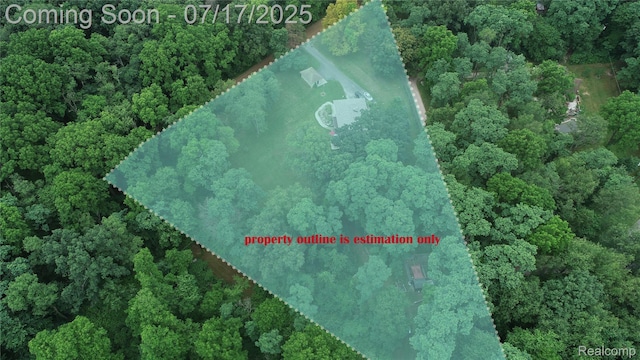 5074 Perryville Rd, Holly, MI 48442 - aerial view of property's location featuring a heavily wooded area and property parcel outlined
