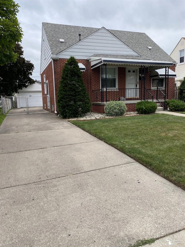 3897 15th St, Wyandotte, MI 48192 - bungalow-style house with brick siding, covered porch, a shingled roof, and a garage