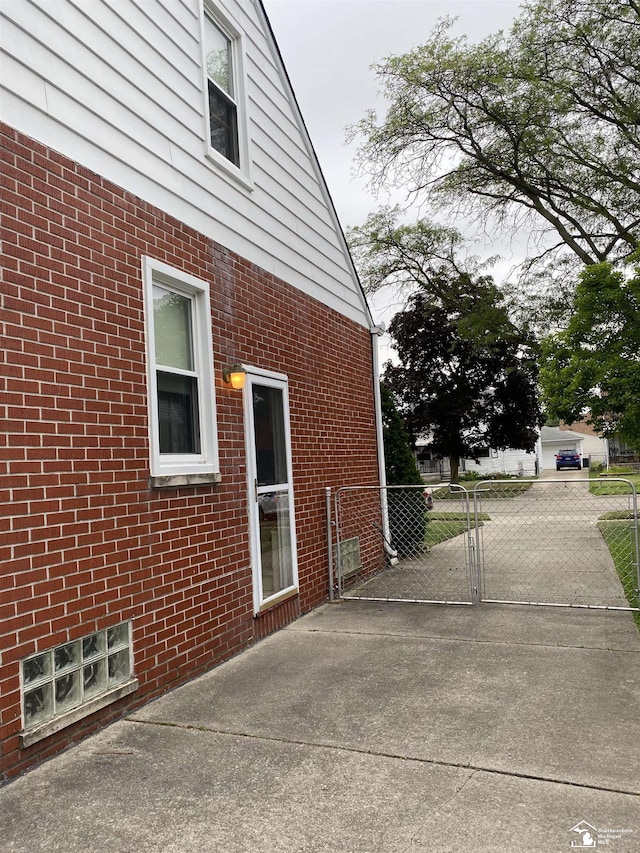 3897 15th St, Wyandotte, MI 48192 - view of side of home featuring brick siding