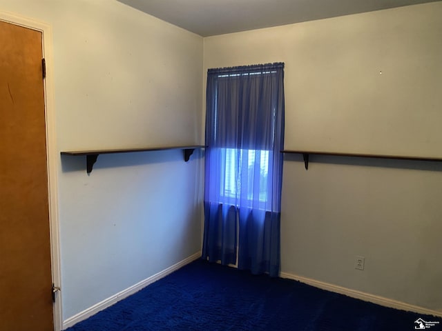 3897 15th St, Wyandotte, MI 48192 - spare room featuring carpet floors and baseboards