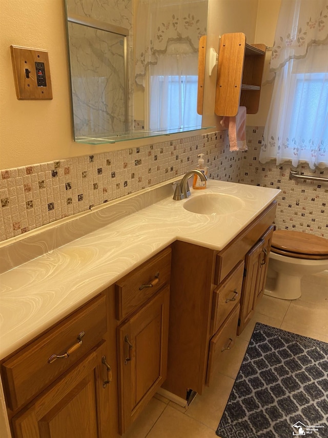3897 15th St, Wyandotte, MI 48192 - full bathroom with double vanity, tile patterned floors, and a shower