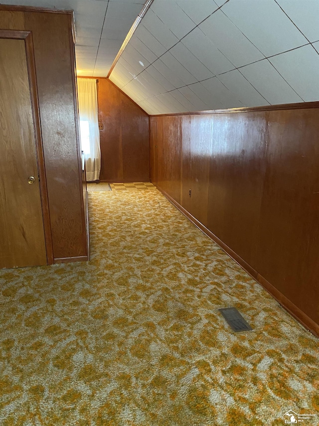 3897 15th St, Wyandotte, MI 48192 - corridor with carpet floors, lofted ceiling, and wooden walls