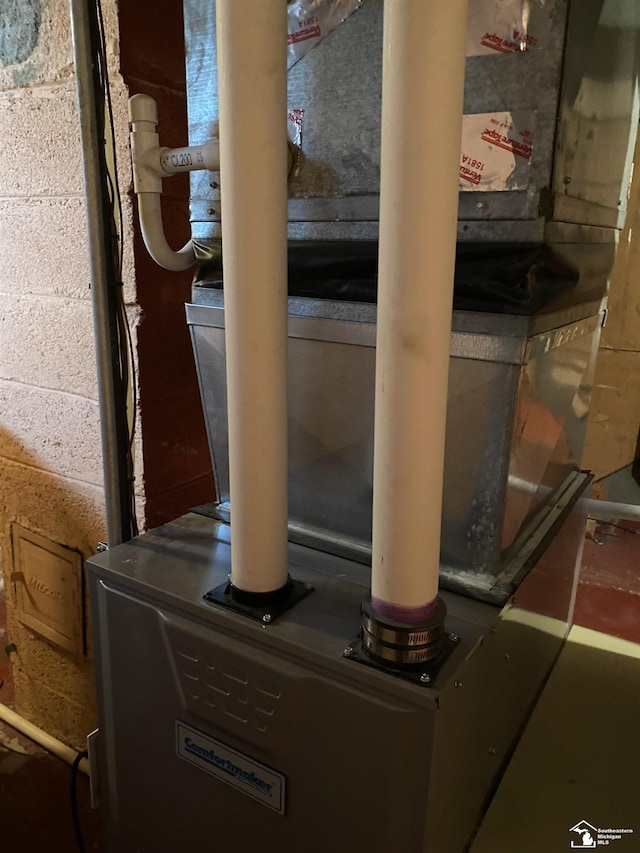 3897 15th St, Wyandotte, MI 48192 - utility room featuring heating unit