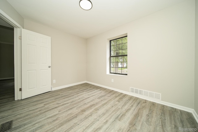 3911 Thomas Ave, Berkley, MI 48072 - unfurnished bedroom featuring light wood-type flooring and baseboards
