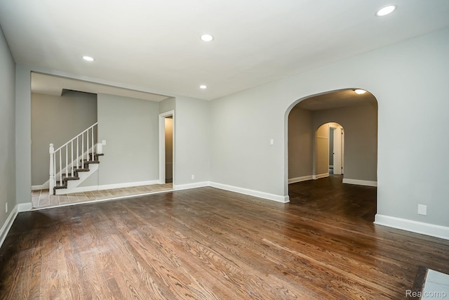 17344 Wisconsin St, Detroit, MI 48221 - unfurnished room with wood finished floors, recessed lighting, stairway, and arched walkways