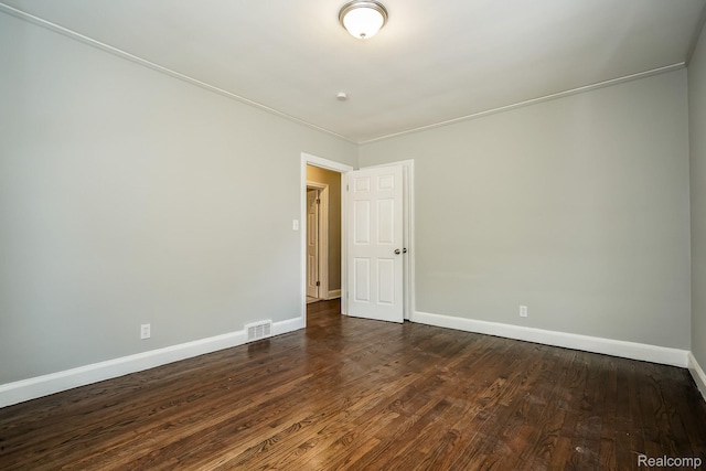 17344 Wisconsin St, Detroit, MI 48221 - unfurnished room with baseboards and dark wood-style floors
