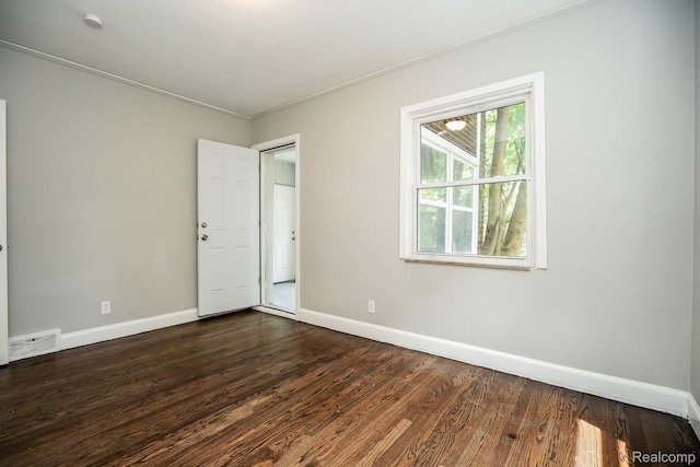 17344 Wisconsin St, Detroit, MI 48221 - spare room featuring dark wood finished floors