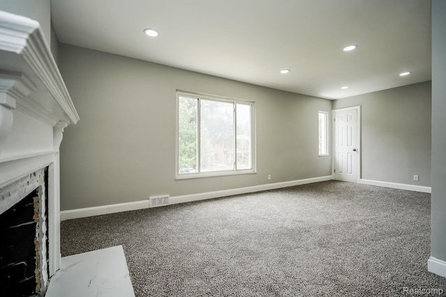 17344 Wisconsin St, Detroit, MI 48221 - unfurnished living room featuring a premium fireplace, carpet floors, and recessed lighting