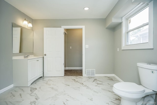 17344 Wisconsin St, Detroit, MI 48221 - bathroom featuring vanity, recessed lighting, and marble look tiles