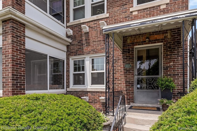 1536 Glynn Ct, Detroit, MI 48206 - view of exterior entry featuring brick siding
