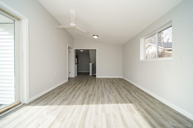 967 Keith St, Oxford, MI 48371 - unfurnished room featuring wood finished floors, vaulted ceiling, and ceiling fan