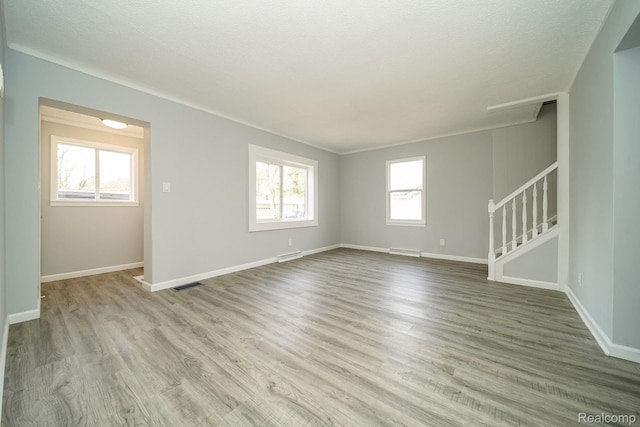 967 Keith St, Oxford, MI 48371 - unfurnished room featuring wood finished floors and stairway