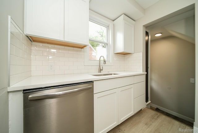 1922 N Wilson Ave, Royal Oak, MI 48073 - kitchen featuring dishwasher, light wood-style flooring, light countertops, white cabinetry, and tasteful backsplash