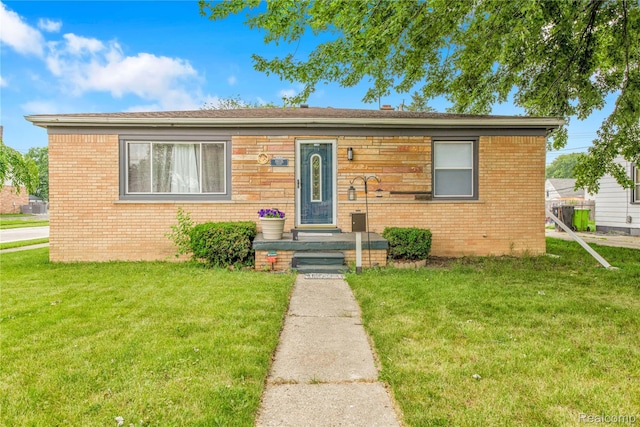 19035 Frazho Rd, Roseville, MI 48066 - bungalow with a front yard and brick siding