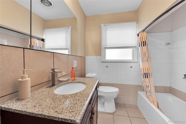 19035 Frazho Rd, Roseville, MI 48066 - full bathroom with tile walls, vanity, tile patterned floors, shower / bath combo with shower curtain, and a wainscoted wall