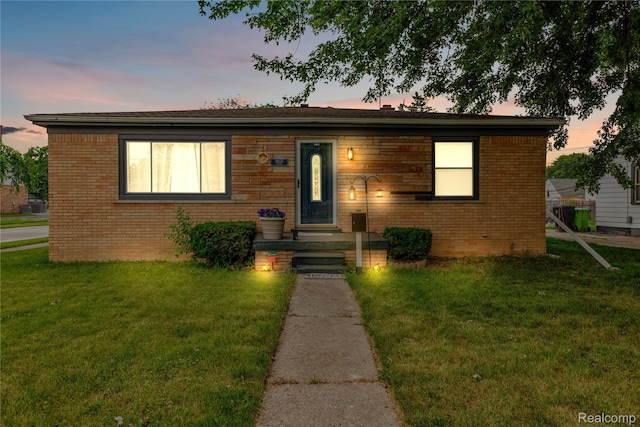 19035 Frazho Rd, Roseville, MI 48066 - view of front of house with a front yard and brick siding