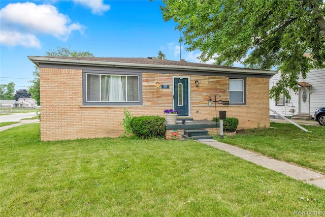 19035 Frazho Rd, Roseville, MI 48066 - bungalow-style house featuring a front yard and brick siding