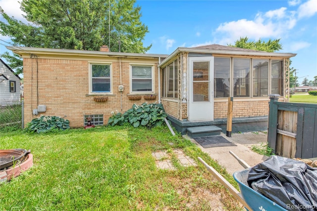 19035 Frazho Rd, Roseville, MI 48066 - view of front of home with brick siding, a sunroom, and a chimney