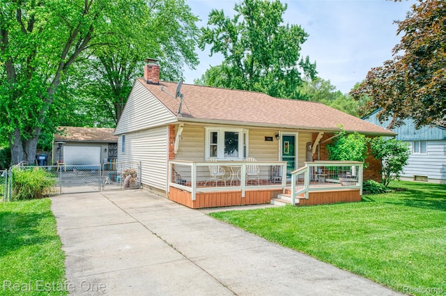 5320 Leland St, Brighton, MI 48116 - view of front of home featuring a porch, a chimney, a front yard, an outbuilding, and a shingled roof