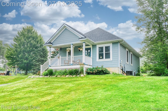 421 Montclair Ln, Howell, MI 48843 - view of front facade featuring a porch, a front lawn, and roof with shingles