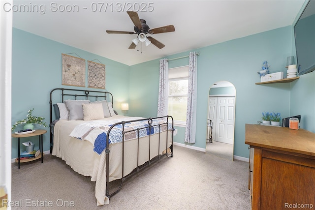 421 Montclair Ln, Howell, MI 48843 - bedroom with light carpet, arched walkways, and ceiling fan