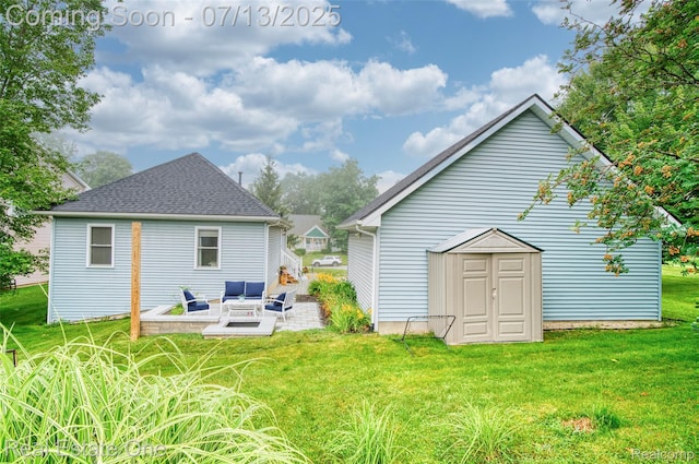 421 Montclair Ln, Howell, MI 48843 - back of property featuring a patio, a yard, an outdoor structure, outdoor lounge area, and roof with shingles