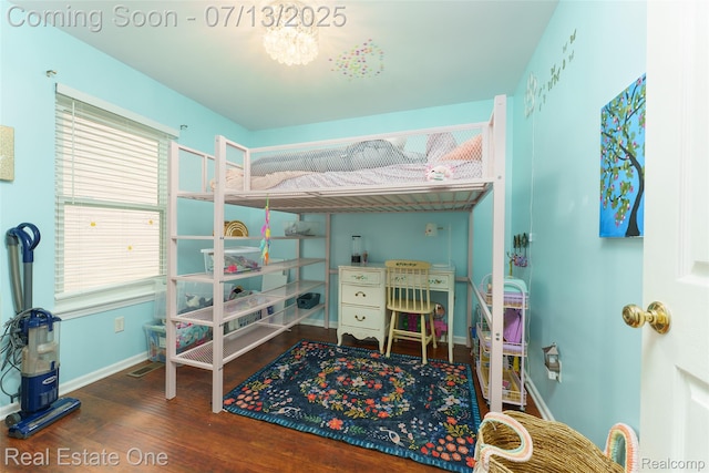 421 Montclair Ln, Howell, MI 48843 - bedroom with wood finished floors, multiple windows, and a chandelier