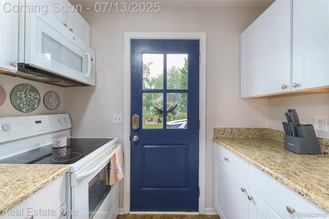 421 Montclair Ln, Howell, MI 48843 - kitchen featuring white appliances, white cabinetry, and light stone counters