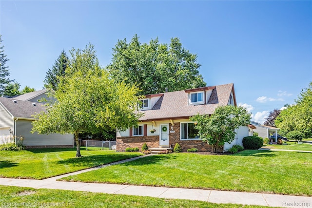 61374 Dean Dr, South Lyon, MI 48178 - view of front of house featuring brick siding and roof with shingles