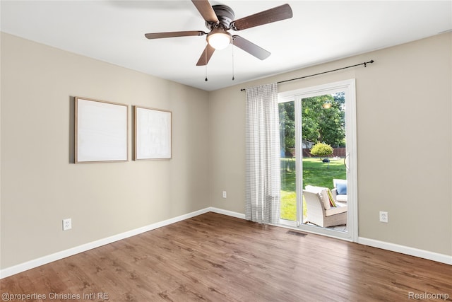 61374 Dean Dr, South Lyon, MI 48178 - empty room with wood finished floors and a ceiling fan