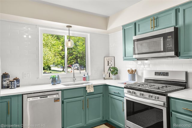 61374 Dean Dr, South Lyon, MI 48178 - kitchen featuring stainless steel appliances, tasteful backsplash, green cabinets, and light countertops