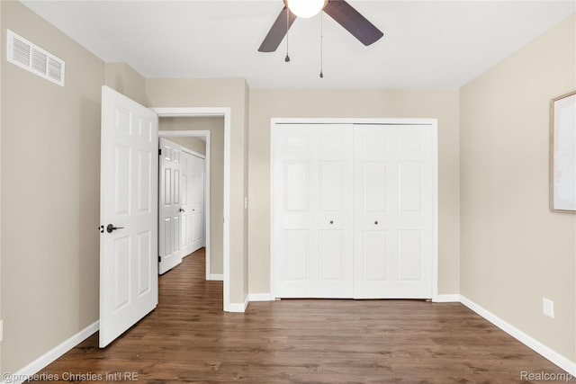 61374 Dean Dr, South Lyon, MI 48178 - unfurnished bedroom featuring dark wood-style flooring, a closet, and ceiling fan