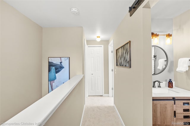 61374 Dean Dr, South Lyon, MI 48178 - hallway with a barn door and light colored carpet
