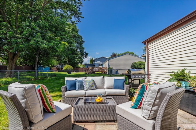 61374 Dean Dr, South Lyon, MI 48178 - fenced backyard featuring grilling area and outdoor lounge area