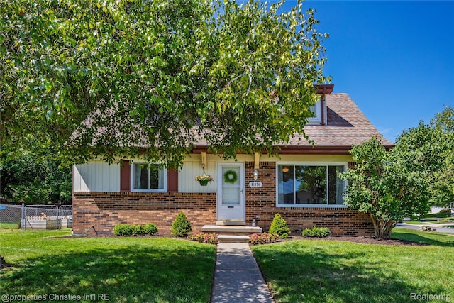 61374 Dean Dr, South Lyon, MI 48178 - view of front of home featuring brick siding and roof with shingles