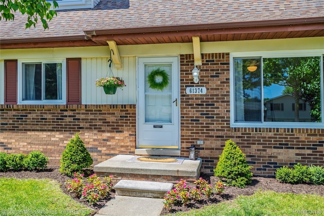 61374 Dean Dr, South Lyon, MI 48178 - doorway to property with brick siding and roof with shingles