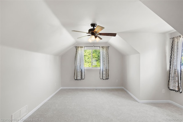 61374 Dean Dr, South Lyon, MI 48178 - additional living space with a ceiling fan, light carpet, and vaulted ceiling