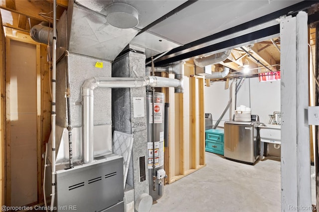 61374 Dean Dr, South Lyon, MI 48178 - utility room featuring washer / dryer and water heater