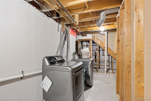 61374 Dean Dr, South Lyon, MI 48178 - washroom with washer and dryer and a textured wall