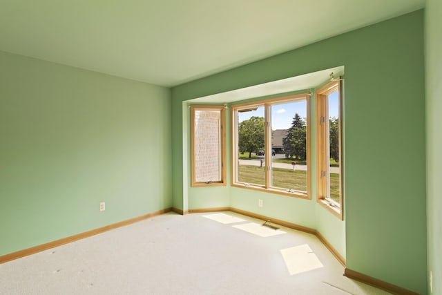 7184 Steeplechase Dr, Saline, MI 48176 - spare room featuring carpet and baseboards
