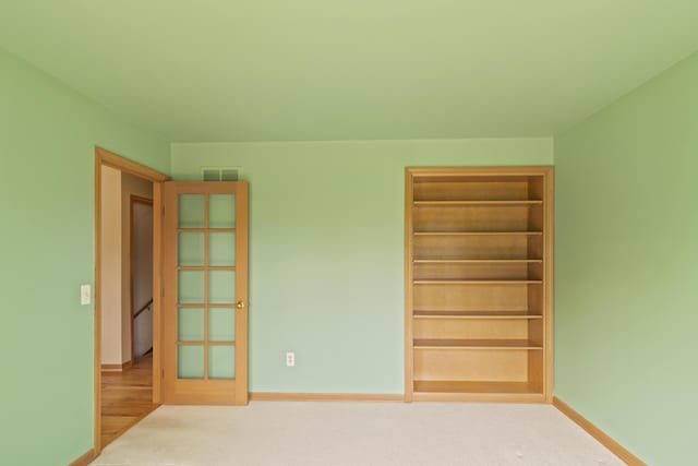 7184 Steeplechase Dr, Saline, MI 48176 - spare room featuring baseboards and carpet flooring