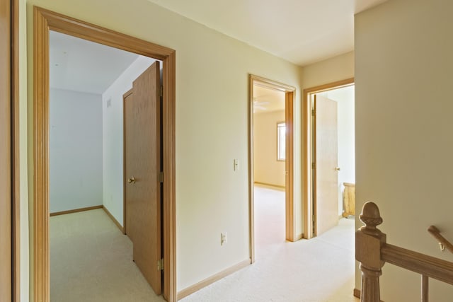 7184 Steeplechase Dr, Saline, MI 48176 - hallway featuring light carpet and an upstairs landing