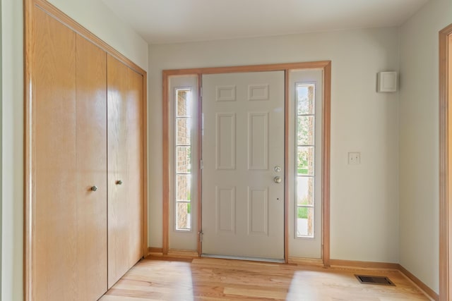 7184 Steeplechase Dr, Saline, MI 48176 - entrance foyer with light wood-style floors and baseboards