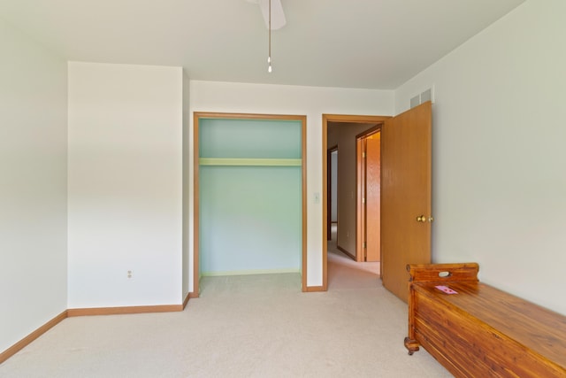 7184 Steeplechase Dr, Saline, MI 48176 - unfurnished bedroom featuring light carpet, a closet, and a ceiling fan