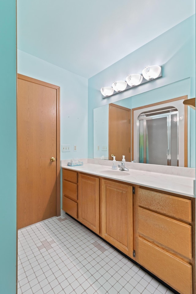 7184 Steeplechase Dr, Saline, MI 48176 - full bathroom with vanity, tile patterned flooring, and a shower with door