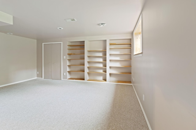 7184 Steeplechase Dr, Saline, MI 48176 - carpeted spare room featuring baseboards and built in features